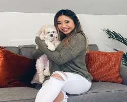 Kristi is accompanied by a cute dog in her home whom she calls Chloe.